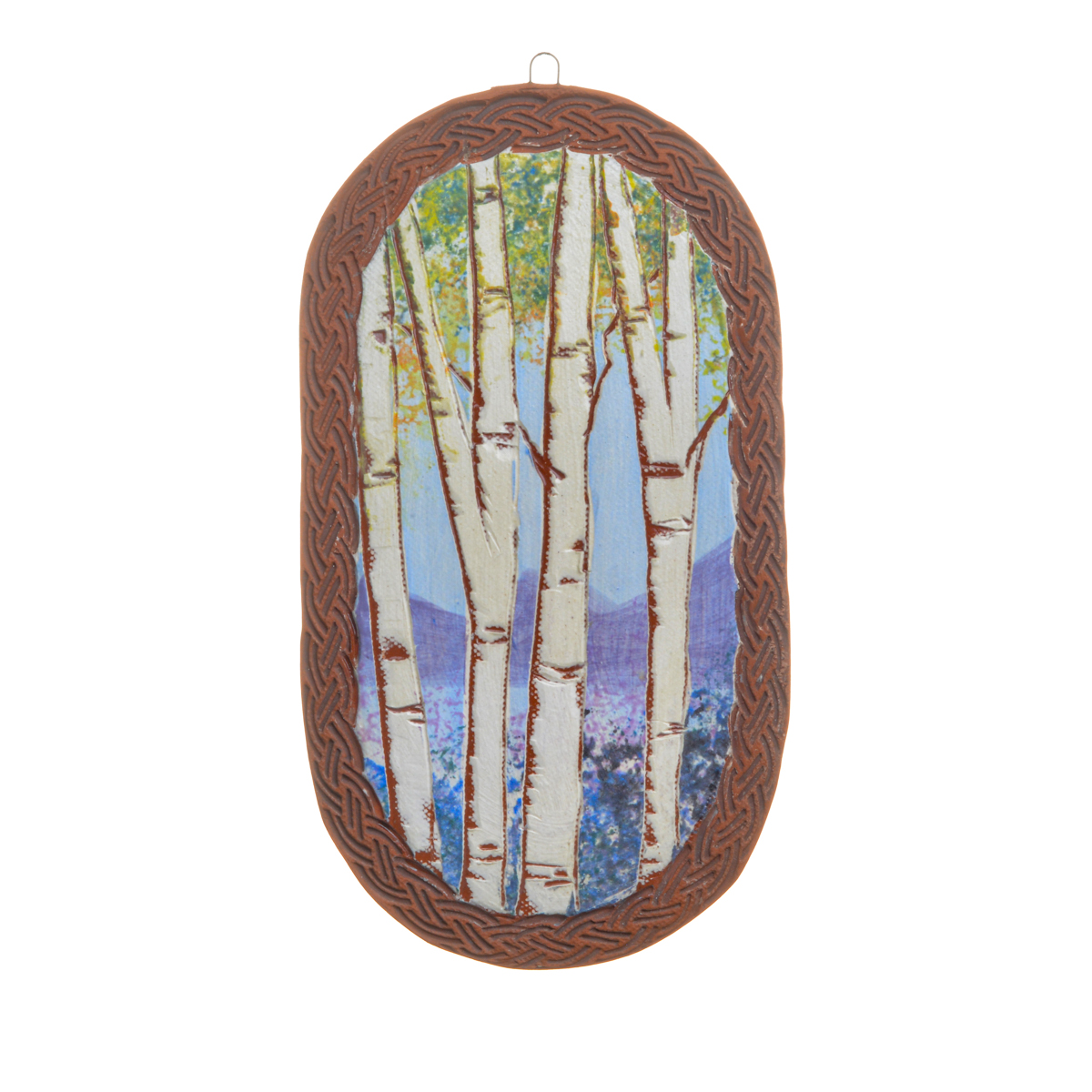 Forest wall tile featuring hand-built and hand-painted pieces that contrast the rawness of the earthenware with a “canvas” of white slip, on which a forest scene is applied using underglazes. Each wall tile is “framed” by raw clay, like a painting or looking through a window. Each sold separately. Different styles available.