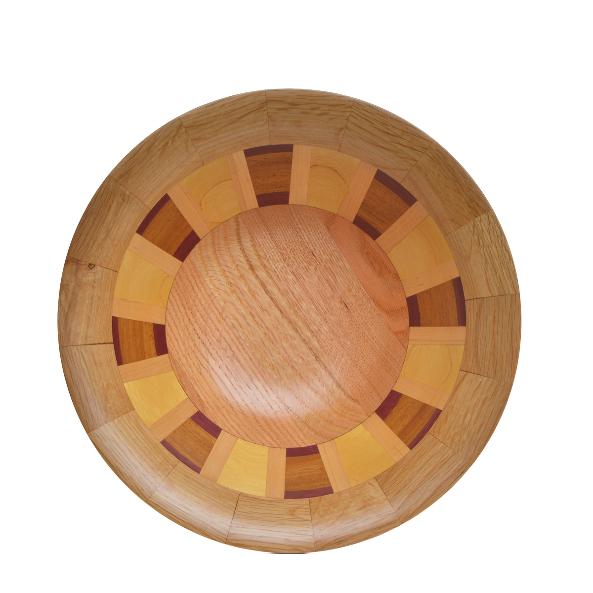 Segmented turned bowl made using oak, yellowheart, cherry, and purpleheart . No stains are used. All woods are natural color.