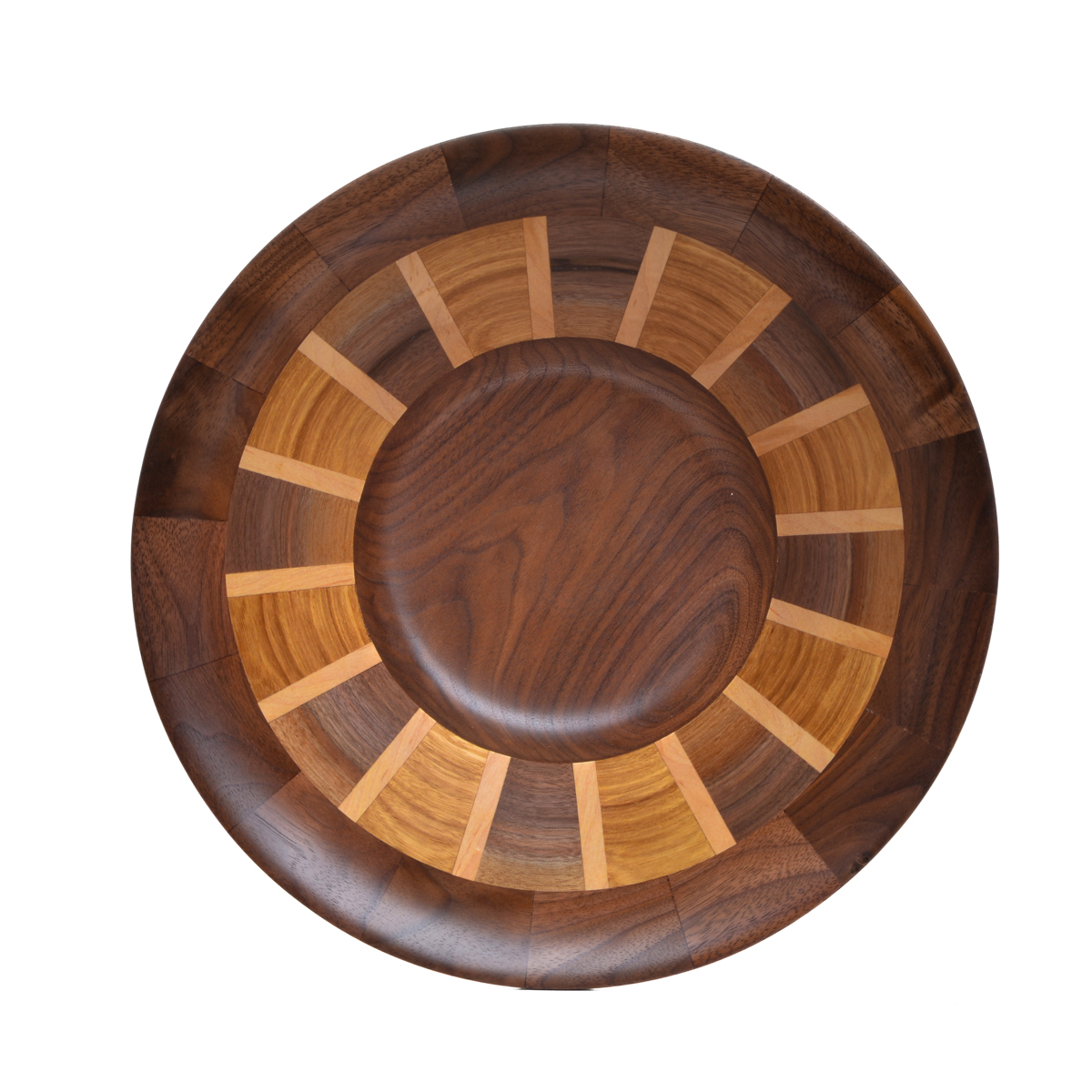 Segmented turned bowl made using walnut, cherry, and maple. No stains are used. All woods are natural color.
